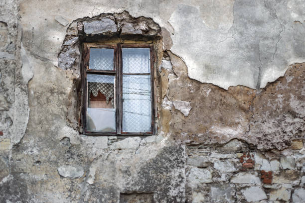 istock Old broken window in the old facade of the building. 1155445811