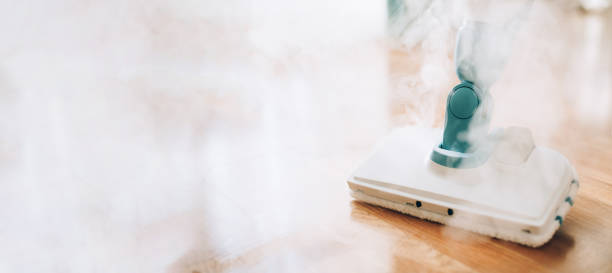 istock Steam cleaner mop cleaining floor. Banner with copy space. Cleaning service concept 1155445915