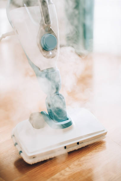 istock Steam cleaner mop cleaining floor. Banner with copy space. Cleaning service concept 1155445919