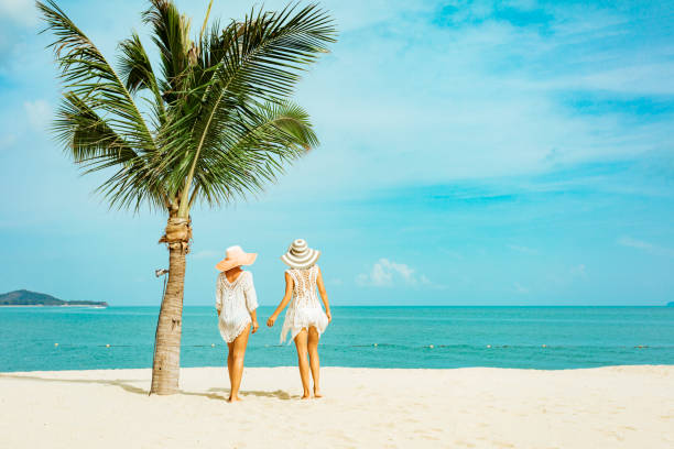 istock Cuople woman at tropical beach 1155447567