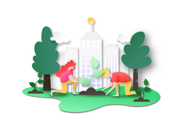 istock People plant tree at city to green world. 1155451614