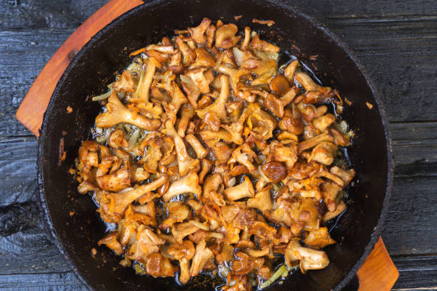 istock Fried chanterelle mushrooms in a cast iron pan 1155452485