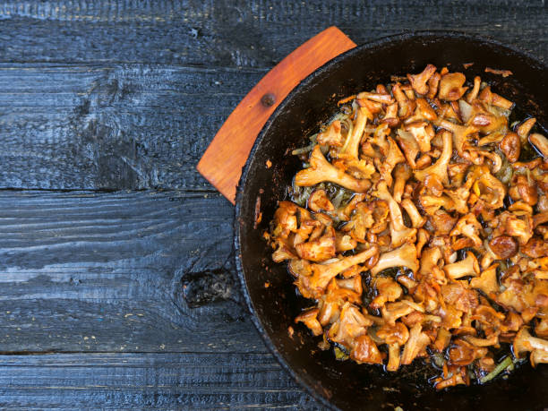 istock Fried chanterelle mushrooms in a cast iron pan 1155452486