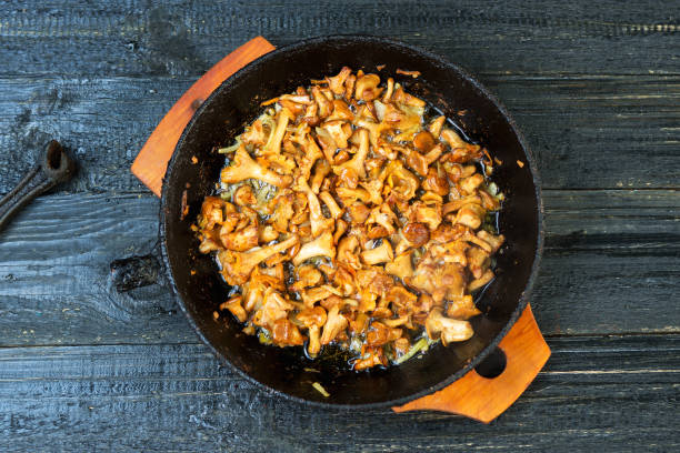 istock Fried chanterelle mushrooms in a cast iron pan 1155452530