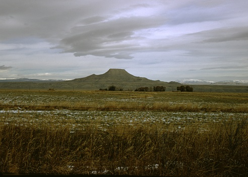 Mountain in distance under cloudy skies, 1965