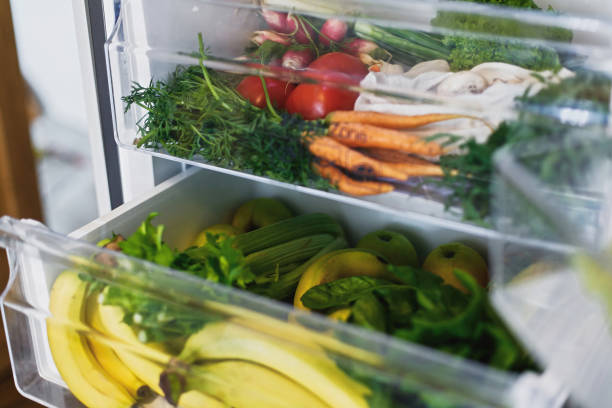 istock Zero waste grocery in fridge. Fresh vegetables in opened drawer in refrigerator. Plastic free carrots,tomatoes, mushrooms,bananas,salad, celery, apples, zero waste shopping. Grocery delivery 1155458543