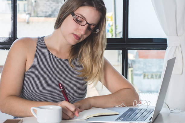 istock Woman working on laptop at home. 1155459070