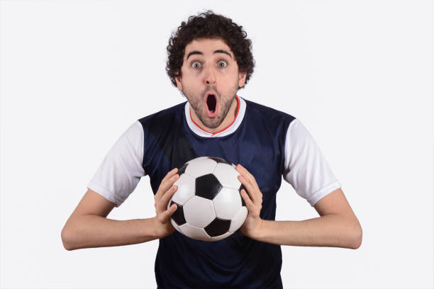 istock Man screaming with soccer ball. 1155459092