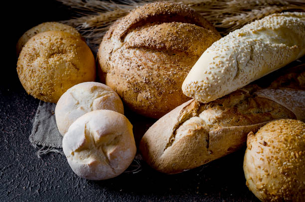 istock Assortment of baked goods in black background 1155459231