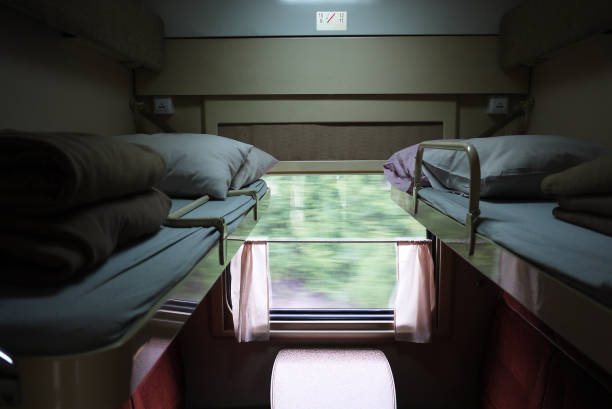 istock View of sleeping places in a compartment car. 1155460980
