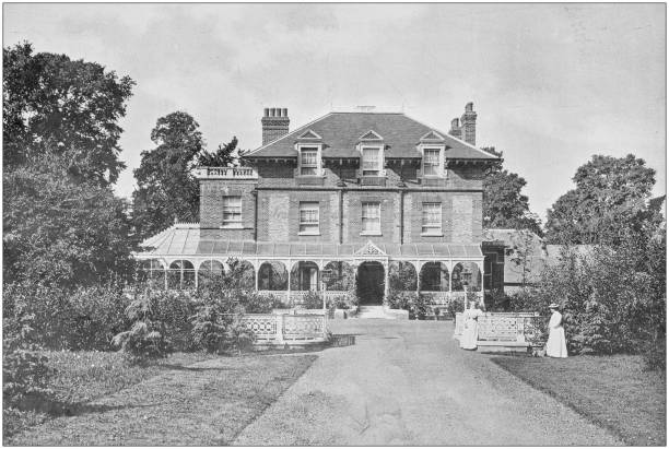 istock Antique vintage black and white photo: British countryside house 1155462689