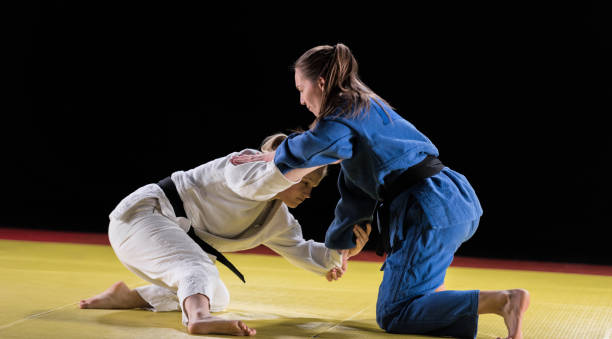 istock Female Judo Players Competing In Judo Match 1155467976