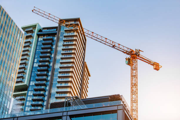 istock Low angle view of construction crane in downtown Vancouver 1155473504