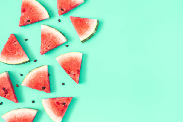 istock Watermelon pattern. Red watermelon on mint background. Summer concept. Flat lay, top view, copy space 1155474227