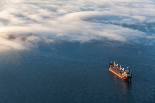 container cargo ship in vancouver's english bay - ocean freight imagens e fotografias de stock