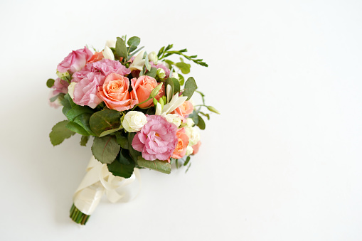 wedding bouquet with flowers roses on a white background with copy space. minimal concept. mockup
