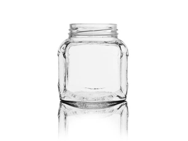 istock Empty glass jar for canned food and jam isolated on white background with reflection 1155478160