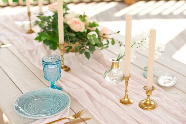 istock Beautiful festive table setting with elegant white flowers and cutlery, dinner table decoration 1155481415