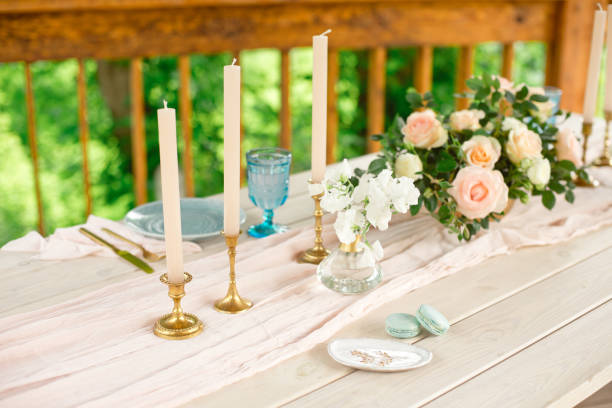 istock Beautiful festive table setting with elegant white flowers and cutlery, dinner table decoration. 1155482037