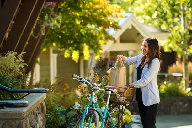 Photo of Woman using a bike to run errands