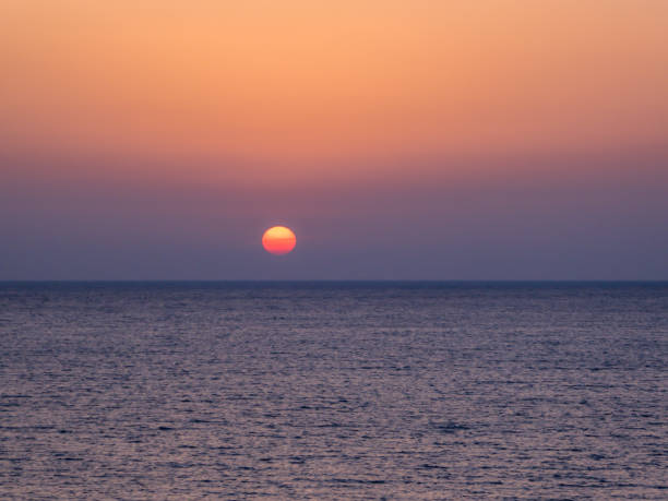 istock Cyprus - Sun goes down into the sea 1155482161