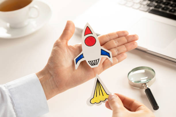 istock Business Person with Startup Rocket 1155483980