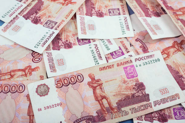 istock Stack of banknotes, many banknotes of five thousand Russian rubles as a background, packed stack of banknotes 5000 rubles, five hundred thousand 1155485902