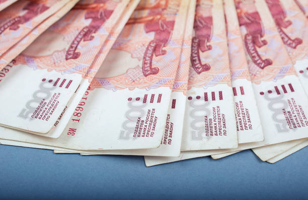 istock Stack of banknotes, many banknotes of five thousand Russian rubles as a background, packed stack of banknotes 5000 rubles, five hundred thousand 1155485914