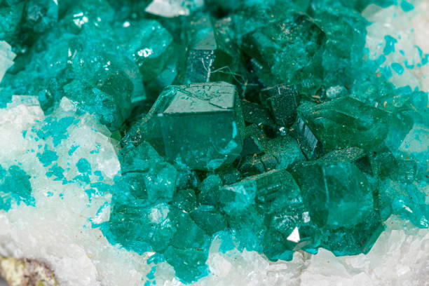 istock Macro mineral stone Dioptase silicate copper on a white background 1155487195