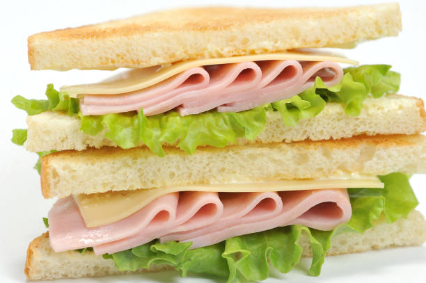 istock Sandwich with ham and cheese from white bread.Macro photography. 1155487582
