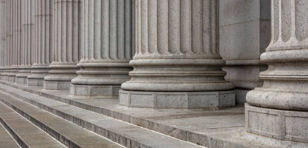 Stone pillars row and stairs detail. Classical building facade Stone colonnade and stairs detail. Classical pillars row in a building facade supreme court justice photos stock pictures, royalty-free photos & images