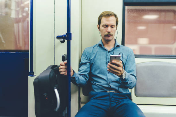 istock Businessman traveling in subway train 1155489421