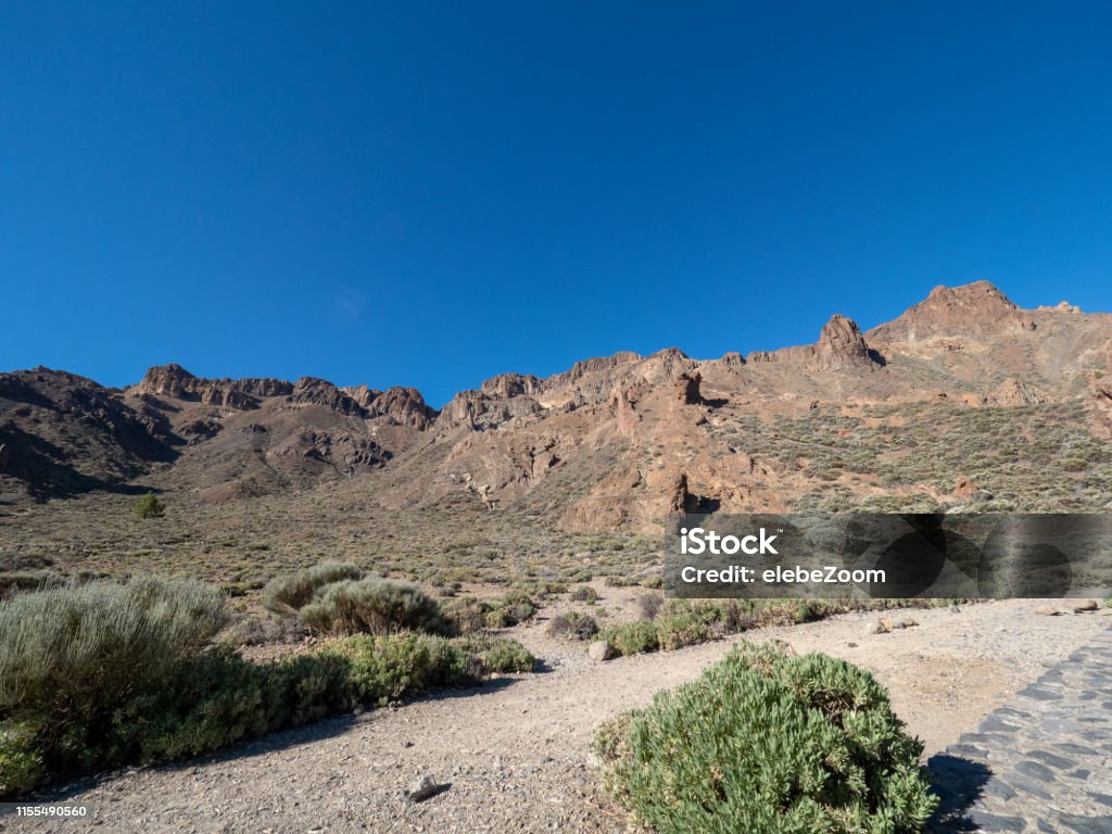 Volcanic landscape in Los Roques, and El Teide Volcanic landscape in Los Roques, and El Teide Volcano in Tenerife, Canary Islands, Spain Arid Climate Stock Photo