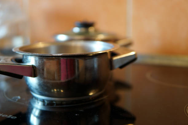 A cooking pot on the gas stove. Close-up and selective focus at the object.