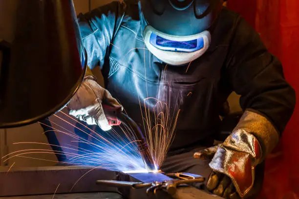 Photo of Industrial steel welder in factory welder, craftsman
