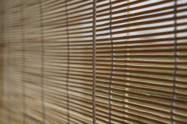 istock Beige Blind Bamboo Japanese Curtain On The Window 1155490618