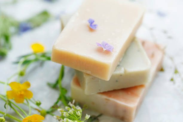 istock Handmade natural soaps with plants and flowers, closeup 1155491283