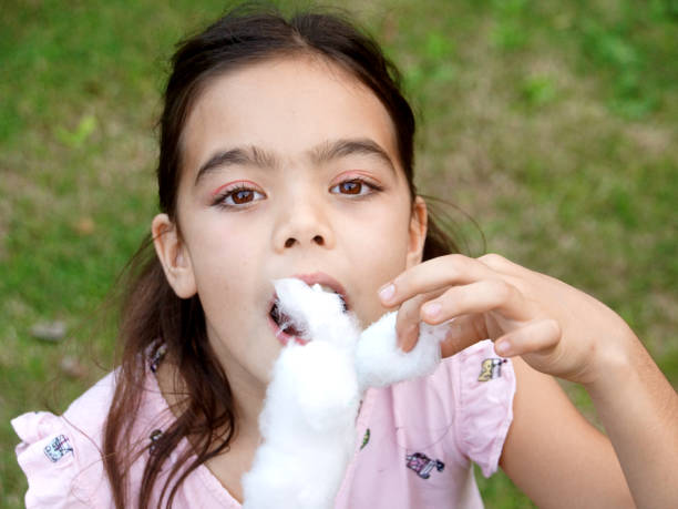 istock Girls Eating cotton candy 1155492539