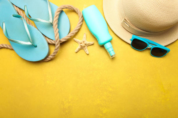 istock Beach straw hat, sunscreen, flip flops and beach decor 1155492607