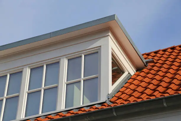 dormer window on red rooftop