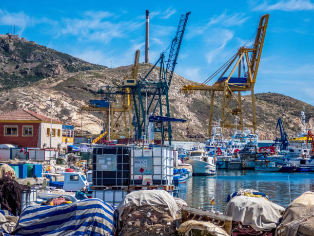 Cranes in sea cargo port. Cartagena, Spain, Mursia Cranes in sea cargo port. Cartagena, Spain, Mursia fishing boat sinking stock pictures, royalty-free photos & images