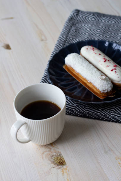 istock Food photography dessert eclair and coffee 1155499141