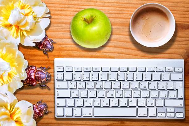 istock Conceptual view of computer bugs on striped wooden desk with keyboard 1155499261
