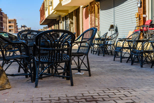 istock Empty tables and chairs in a street cafe 1155500667
