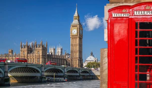 london symbols with big ben, double decker buses and red phone booths in england, uk - big ben london england uk double decker bus imagens e fotografias de stock