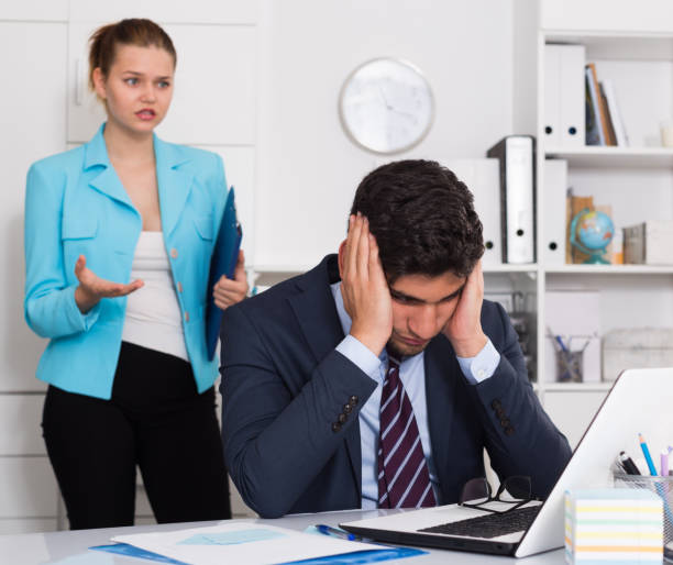 istock Frustrated businessman with angry chief 1155505384