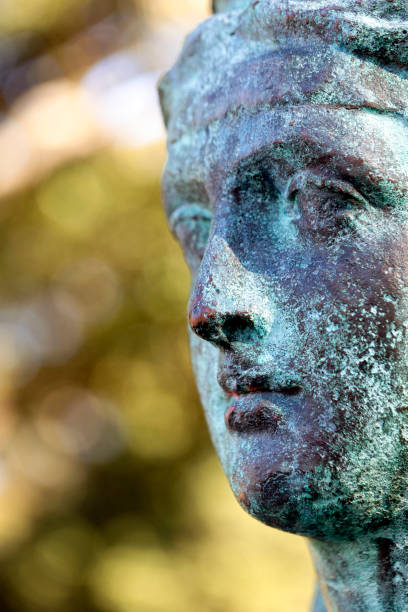 istock Closeup profile of old bronze statue, background with copy space 1155505443