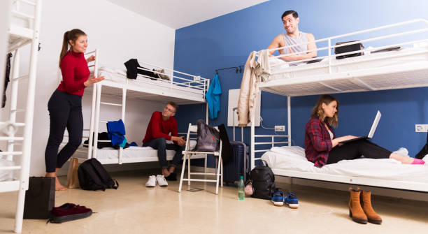 istock Travelers communicating in hostel bedroom 1155505480