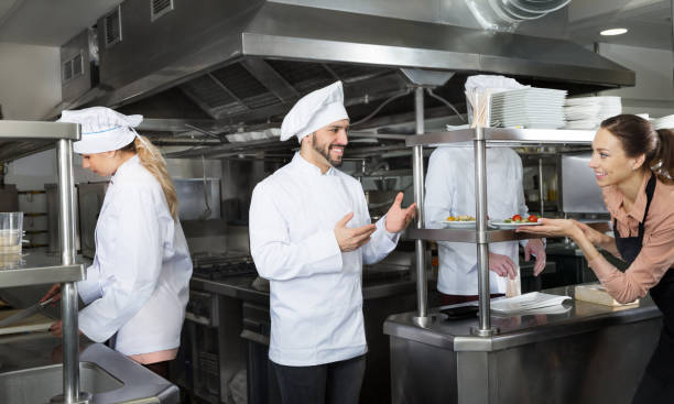 istock Chef checking dishes in kitchen of restaurant 1155506315
