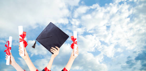 istock Graduation Caps Thrown in the Air 1155508598